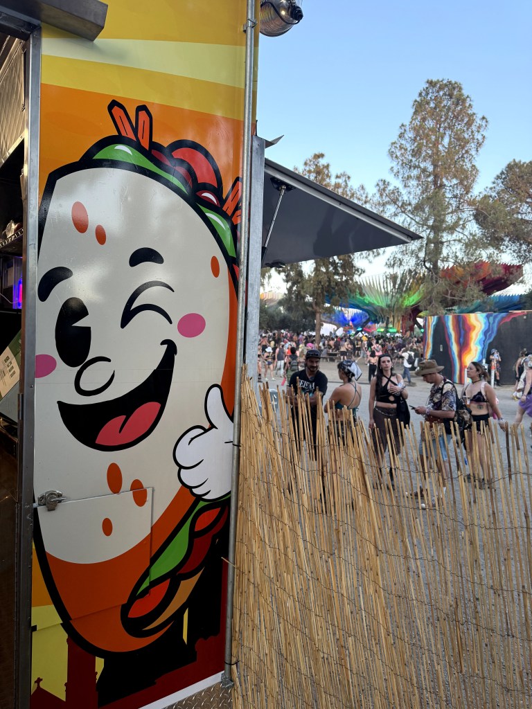 Viet-Naan food truck at Lightning In A Bottle festival. View from behind customer barrier during the day.